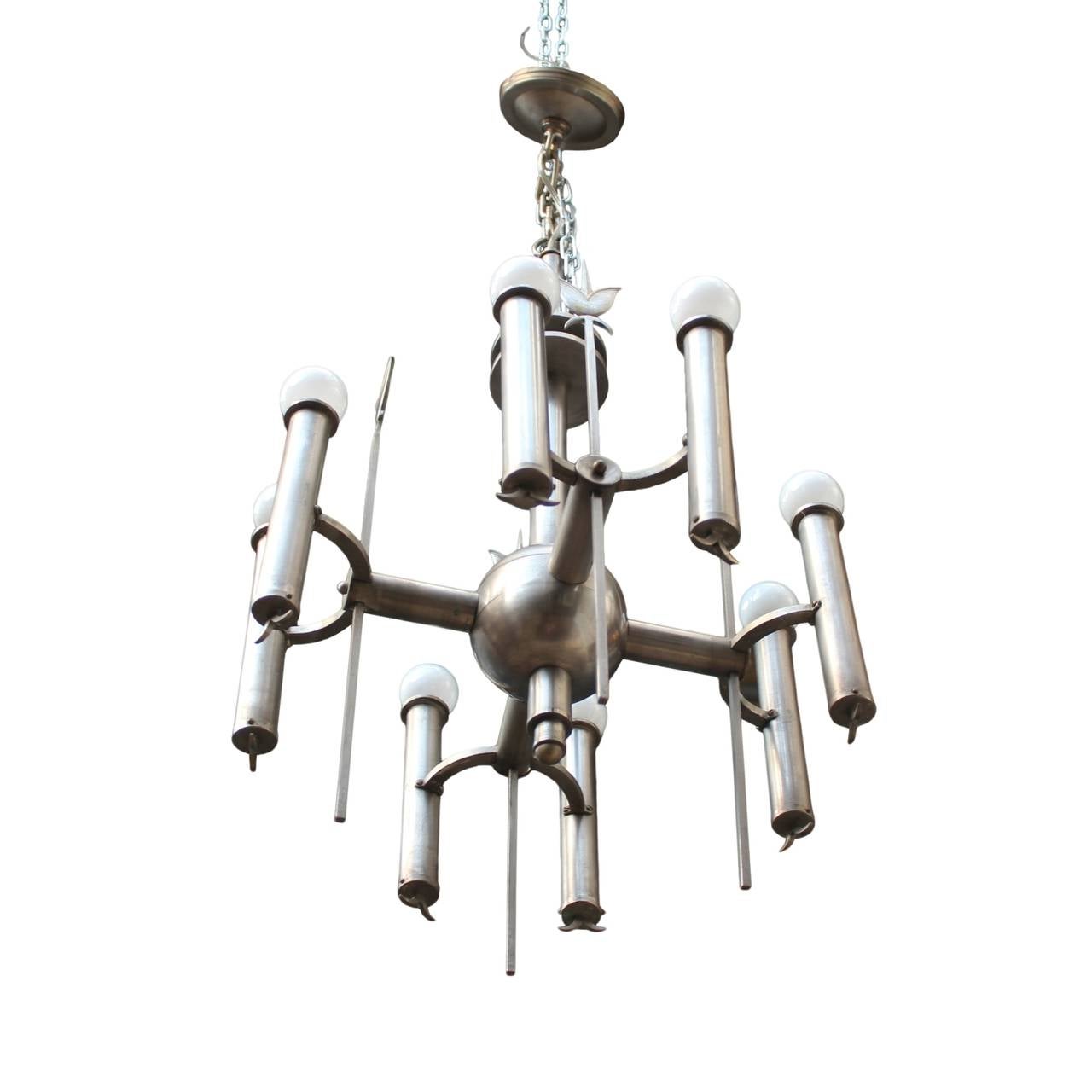 Rare German nickel chandelier having a baton with two floating discs and a central sphere emitting four arms, each with a pair of lights and a decorative spear with stylized fleur de lis head. Re-wired for US standard.