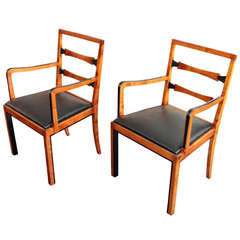 Pair of Swedish Art Deco period parcel ebonized arm chairs by FM Linkoping