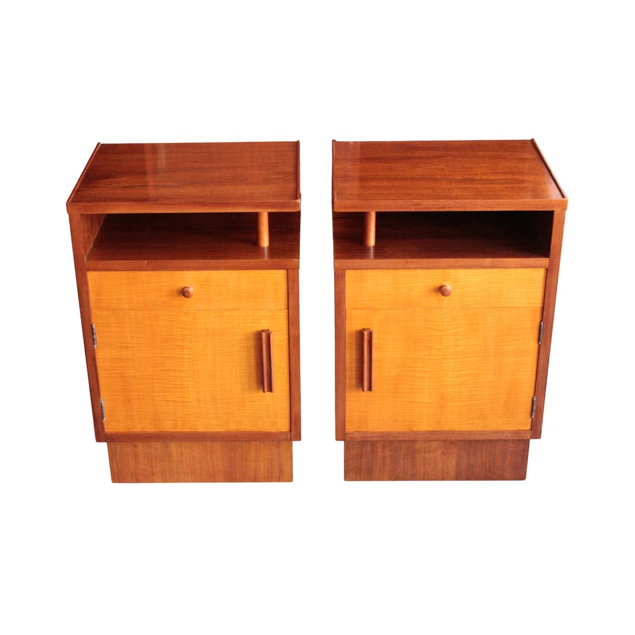 Cabinet in walnut having an exposed storage niche under the top supported by a small colonnette on top of a drawer in satinwood fitted with a round pull and a single door in satinwood fitted with a long handle, enclosing walnut interior with a