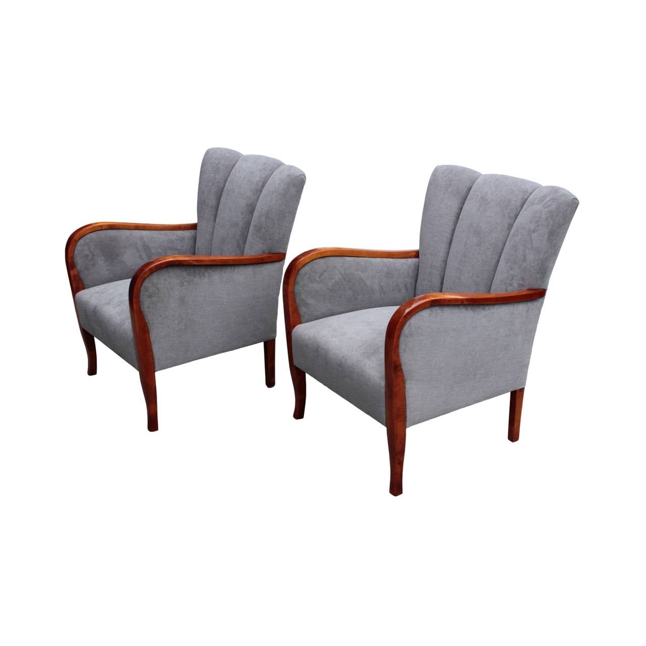 Well-designed pair having slim and elegant curvilinear frames, arms with wider central portion for added comfort ending in very subtle cabriole shaped, slender and tall legs. Twice channeled, waist shaped back rests. In flame birch.