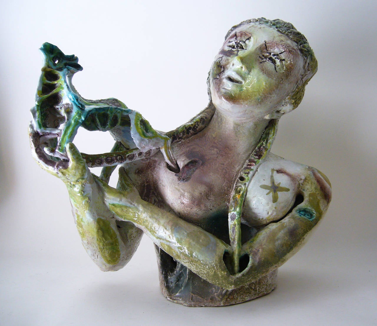 A very rare, Italian modernist hand-painted glazed terra cotta fantasy sculpture created by Alessio Tasca of Italy, circa 1950s. Bust measures 20" in height by 22" wide and is about 10" deep. Signed on verso Tasca, as pictured. In