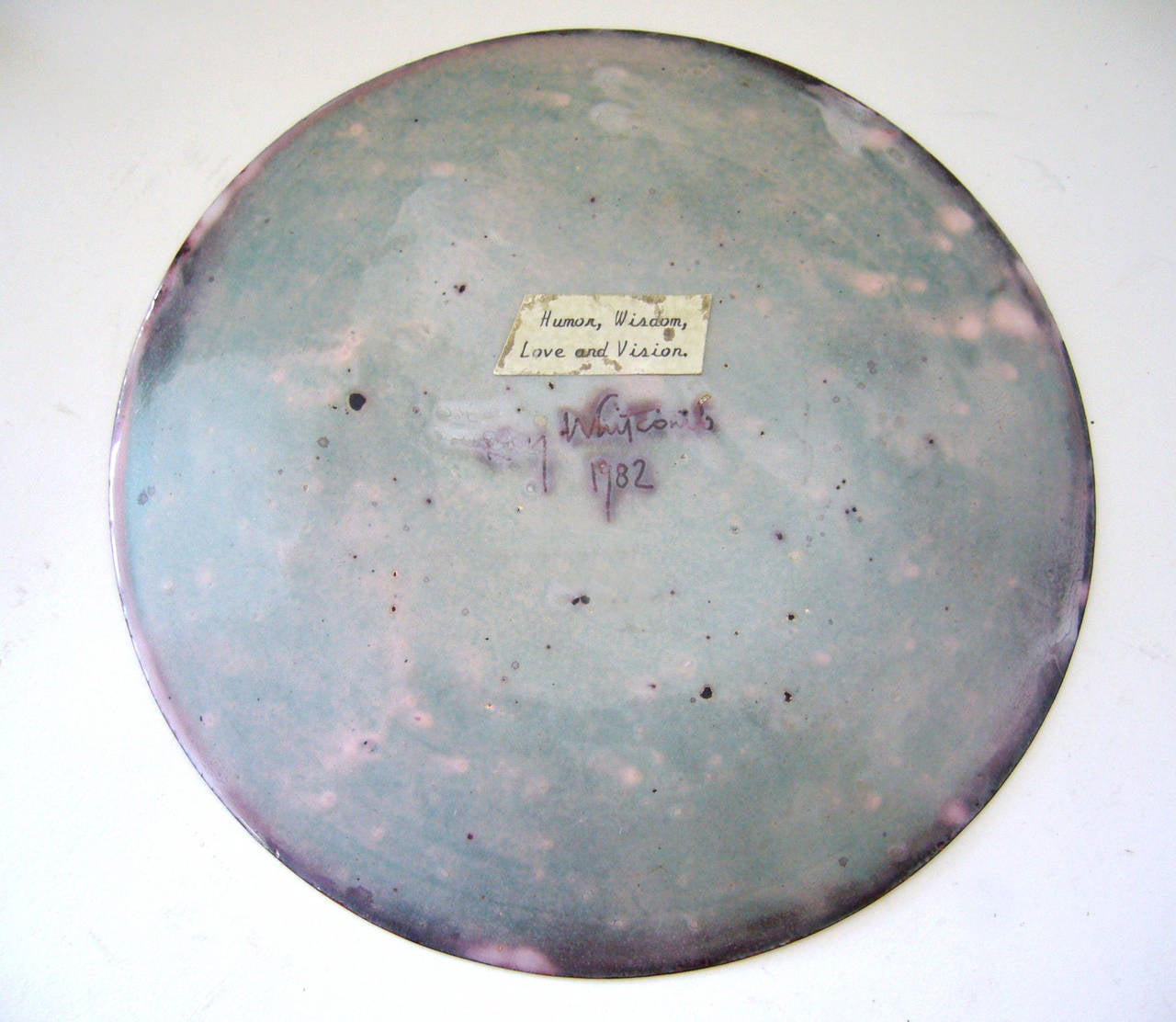 An enamel plate with abstract design, created by Kay Whitcomb of San Diego, California.  Entitled 