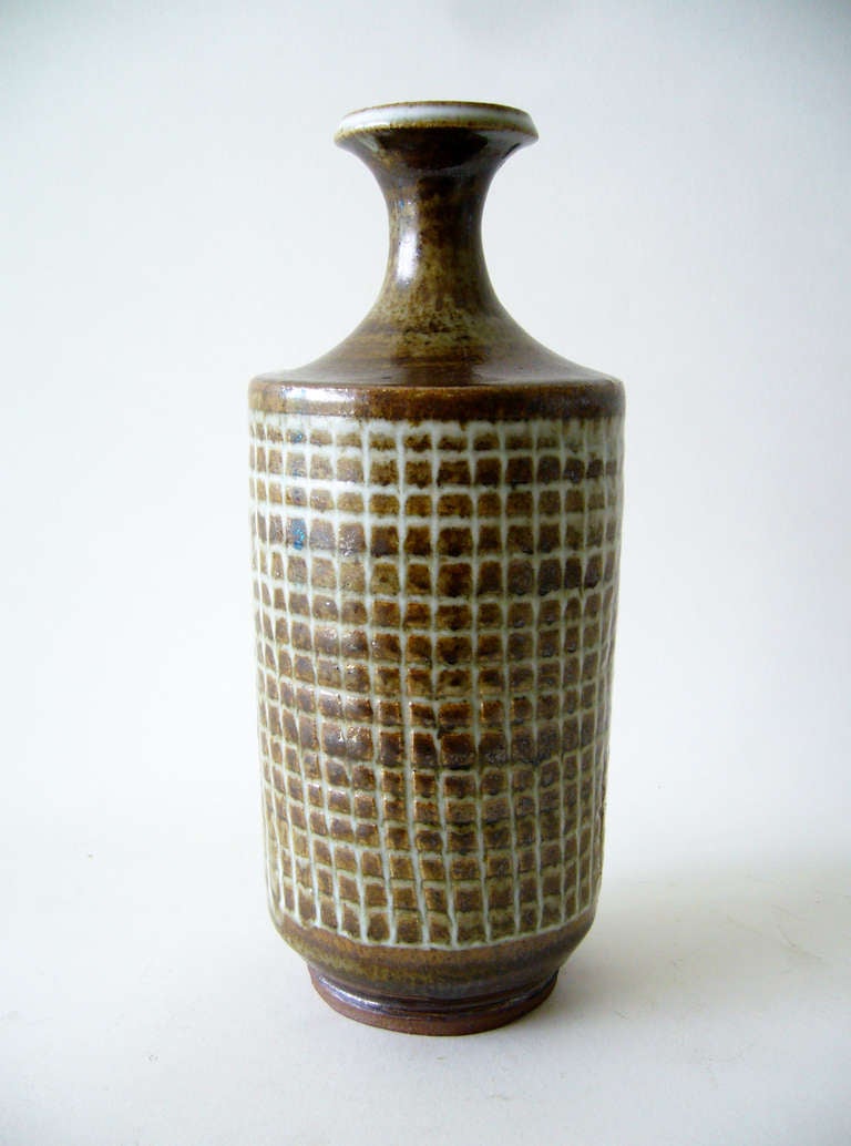 A large, bottleneck form stoneware vase created by Laura Andreson of Los Angeles California.  Andreson was a graduate of UCLA, where she was also the head of the ceramics department for almost forty years.  She died in Los Angeles at the age of 96