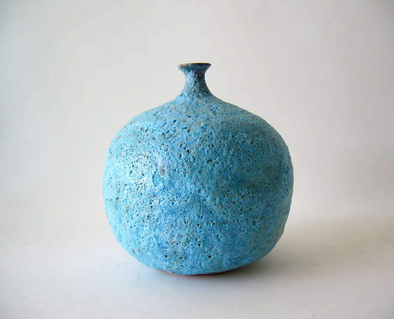 A large, blue foam glazed vase created by Beatrice Wood of Ojai, California.  Wood lived a very long and colorful life including being involved in Vaudeville and friends of artists from the Dada period.  She also studied with master potters Gertrud