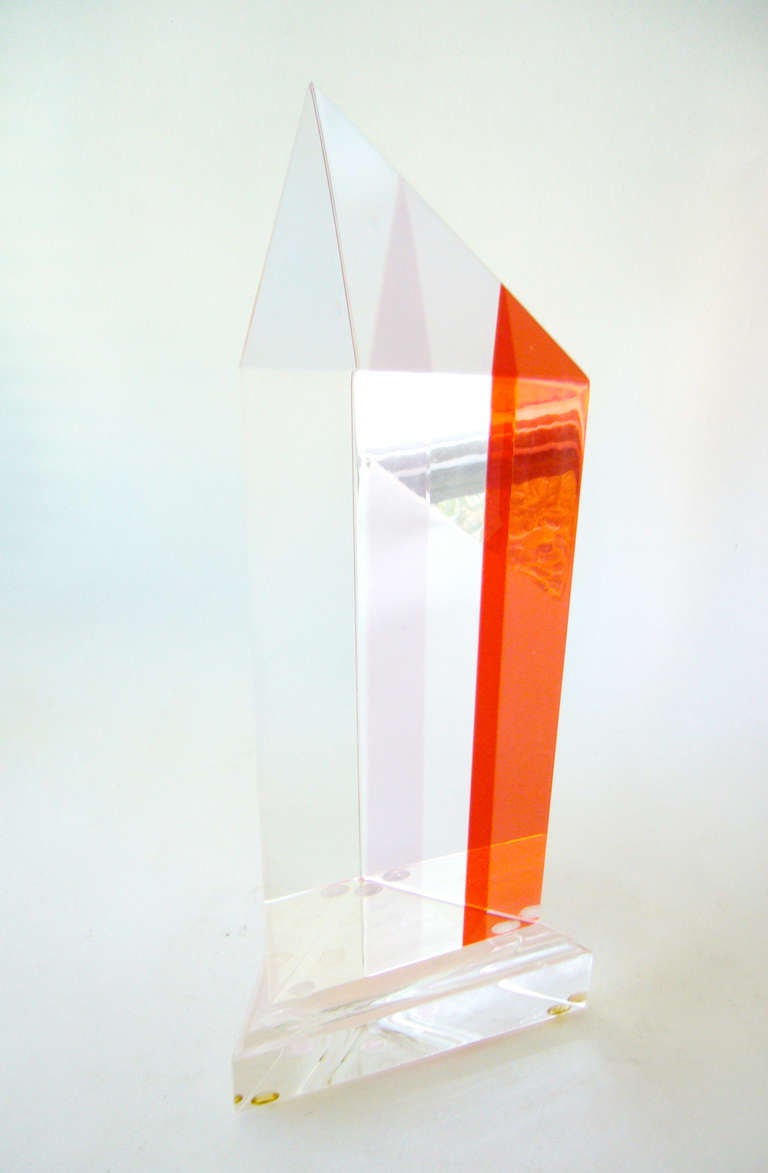 A triangular shaped pyramid acrylic sculpture by Ashley, dated 1986.  Sculpture measures in 13.5