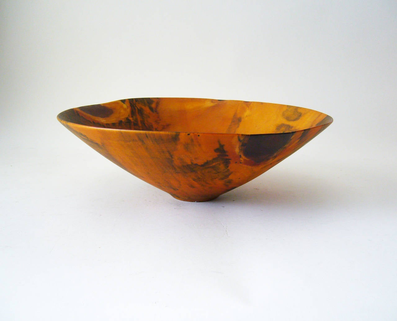 A hand turned pinewood bowl created by master wood artist Ron Kent of Honolulu, Hawaii. Bowl measures 3.25