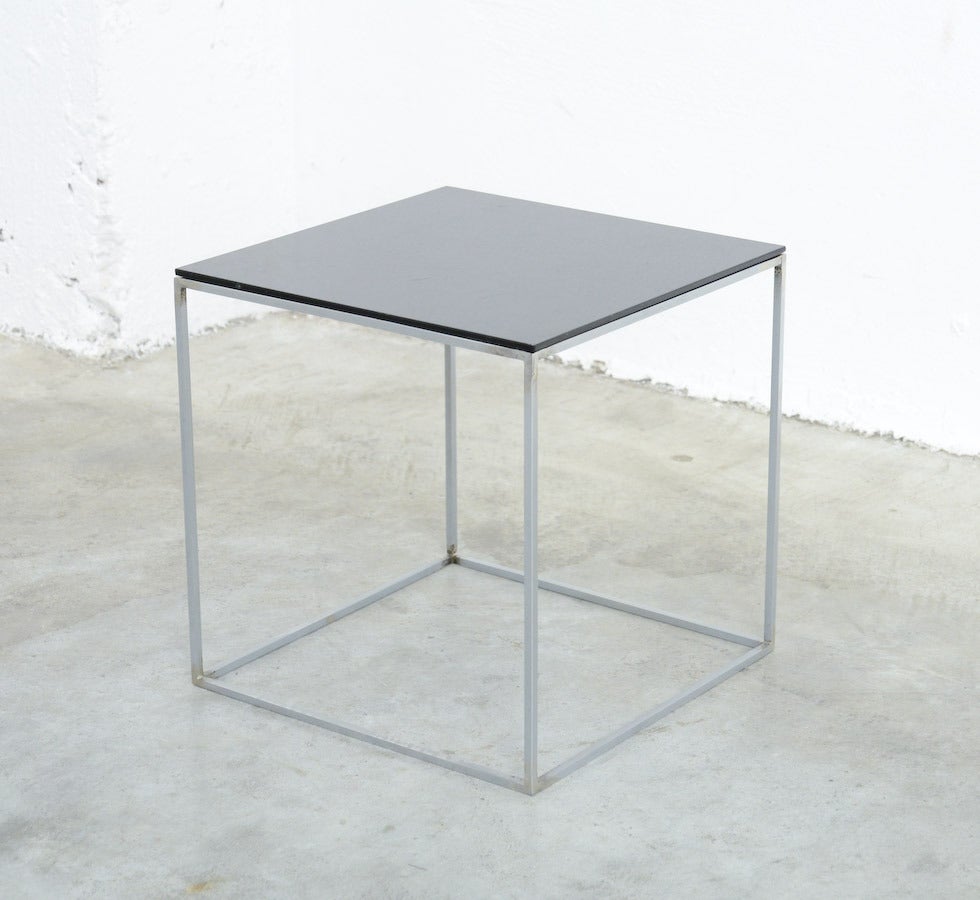 This nice minimal side table was designed by Poul Kjaerholm for E. Kold Christensen, Denmark in 1957.
This old side table is in very good original condition: the brushed steel frame is in good condition, the black acrylic top has some scratches,