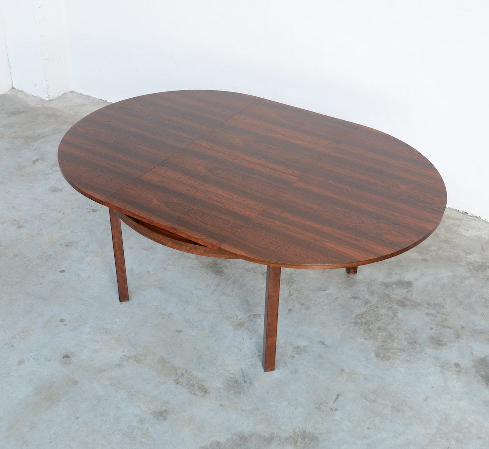 This minimal round extendable dining table is designed by Alfred Hendrickx in the 1960s for Belform.
The table is completely finished with rosewood veneer and can be extended from 128 cm to 188 cm.
This nice and practical table is in very good