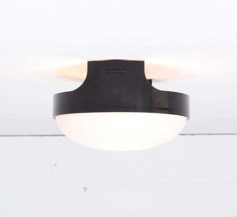 This wall or ceiling lamp Quattro KD 4335 was designed by Joe Colombo in 1967 for Kartell.
The base is made of black ABS plastic, the light sphere of opaline PMMA.
This nice lamp is in perfect vintage condition and marked. It is out of production
