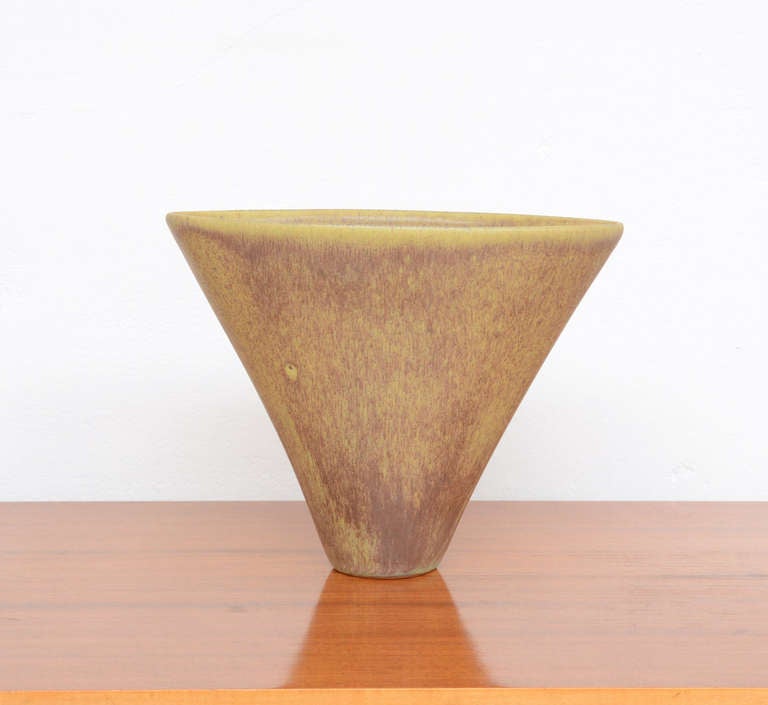 This special shaped vase is designed and made by Antonio Lampecco.<br />
This vase with a nice glaze is in mint condition and marked.<br />
Antonio Lampecco is a Belgian artist with Italian roots. His work is poetic: very nice shaped ceramics with a