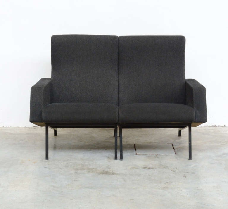 The Miami sofa was designed by Pierre Guariche for Meurop, Belgium in the 1950s. This sofa exists of 2 separate parts.
The nice minimal base is in black lacquered metal. The seat and back are upholstered in dark grey wool, which is still original