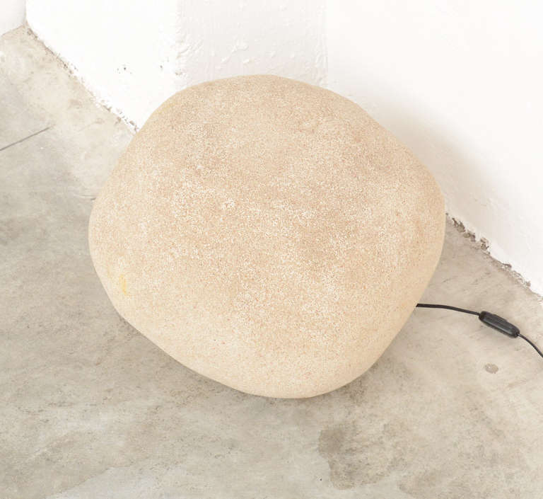 This large rock shaped lamp Dorra was designed by Andre Cazenave in 1969. It is made of resin with marble powder on a round black plastic base. This lamp is in excellent condition, but not marked.