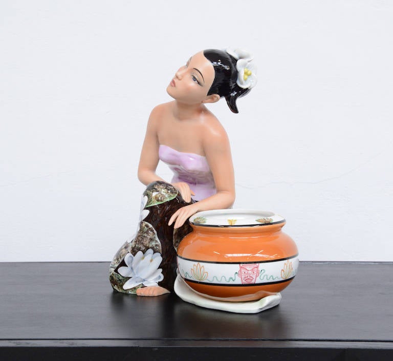This porcelain sculpture of an elegant kneeling woman near a flower pot is designed by the artist Ronzan in Italy in the 1950s.
This sculpture is in mint condition. It is marked, stamped and numbered 346.