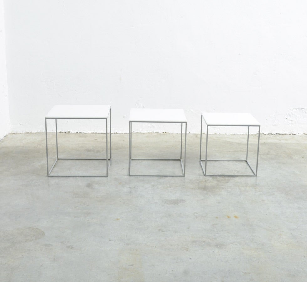 This nice minimal set of side tables was designed by Paul Kjærholm for E. Kold Christensen, Denmark in 1957.
The brushed steel frames are complete with the original white acrylic tops. This very early edition PK71 is marked Denmark in the smallest