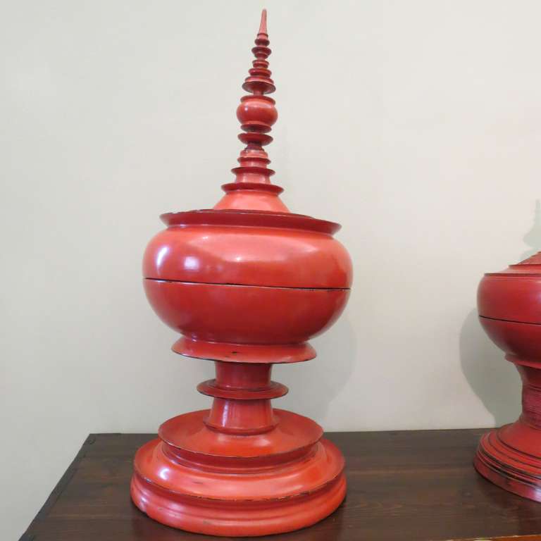 Late 19th Century Burmese
red lacquer special
ceremonial offering vessel.
Detailed spire form the top of
the lid, stepped curved ring
molded bowl above round
base. Multiple layers of red
lacquer adorn this
pagoda shaped ceremonial
vessel.