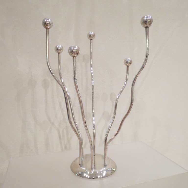 A silver plated candelabra designed and produced in Italy by Mesa.
Stamped on the bottom.