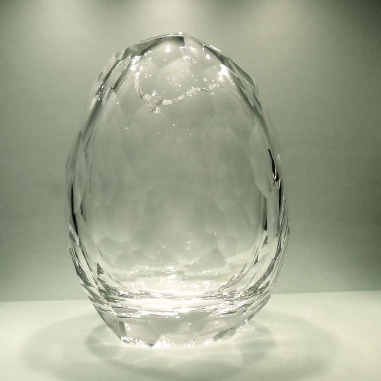 The crystal artisans at Prague's Artel Glass created this Glacier Vase with a wavy cut top and kinetic surface.The Glacier collection represents a partnership between the hot young American designer David Wiseman and Artel. Wiseman designed the