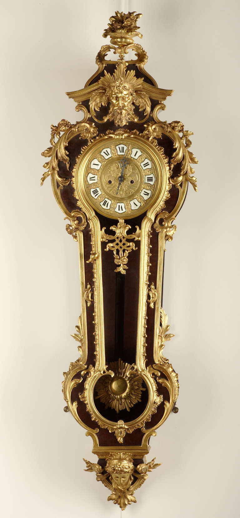 A French Regence style wall clock

Dial signed M*** Taccard & King Hervelry Co., St. Louis

St. Louis (Mo), USA
Circa 1880
Height : 122 cm (48 in.) ; Width : 40 cm (15 3/4 in.) ; Depth : 13 cm (5 in.)

Executed in Mahogany, with a foliate