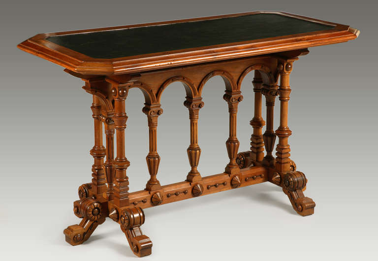 A neo-Renaissance table

France
Circa 1880
Height : 74 cm (29 in.) ; Width : 130 cm (51 1/4 in.) ; Depth : 66 cm (26 in.)

Walnut table carved with Renaissance style motifs. Raised on six legs joined by a stretcher, with architectural