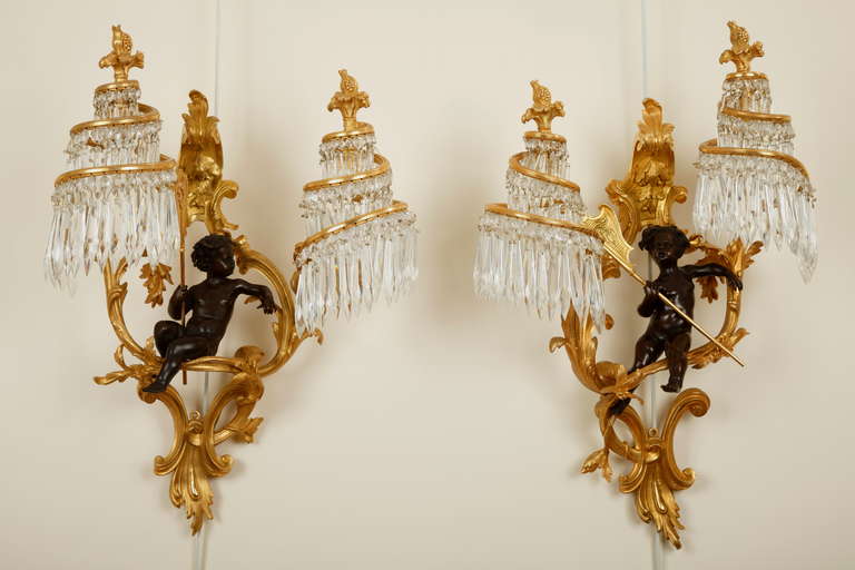 H. Beau
Lightmaker
(1855-1937)

Pair of Marine Children Wall-Lights

Signed H. Beau

France
Circa 1890
Height : 58 cm (22 3/4 in.) ; Width : 40 cm (15 3/4 in.) ; Depth : 23cm (9 in.)

Pair of Louis XV style gilt-bronze sconces. With two