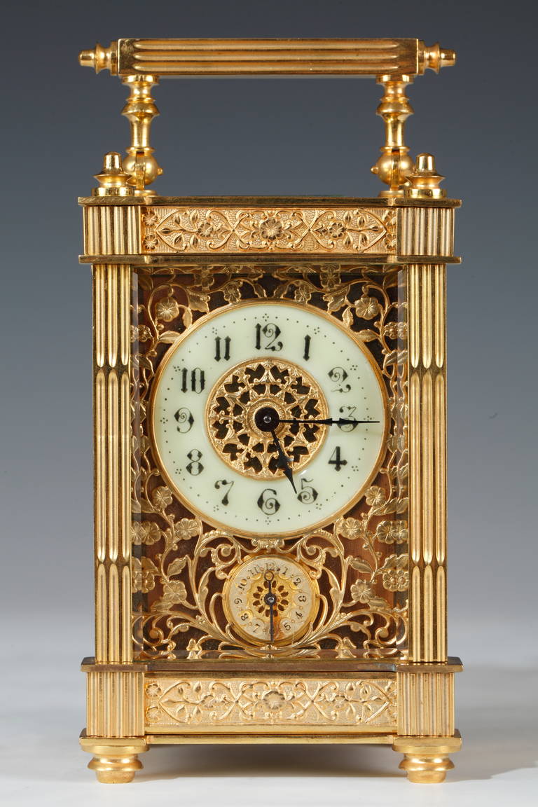 Carriage clock.

France.
Second half of the 19th century.
Measures: Height: 15.5 cm (6 in.); width: 8 cm (3 in.); depth: 6.5 cm (2 2/3 in.).

A beautiful carriage clock with alarm function by mechanical movement, made of gilded bronze with