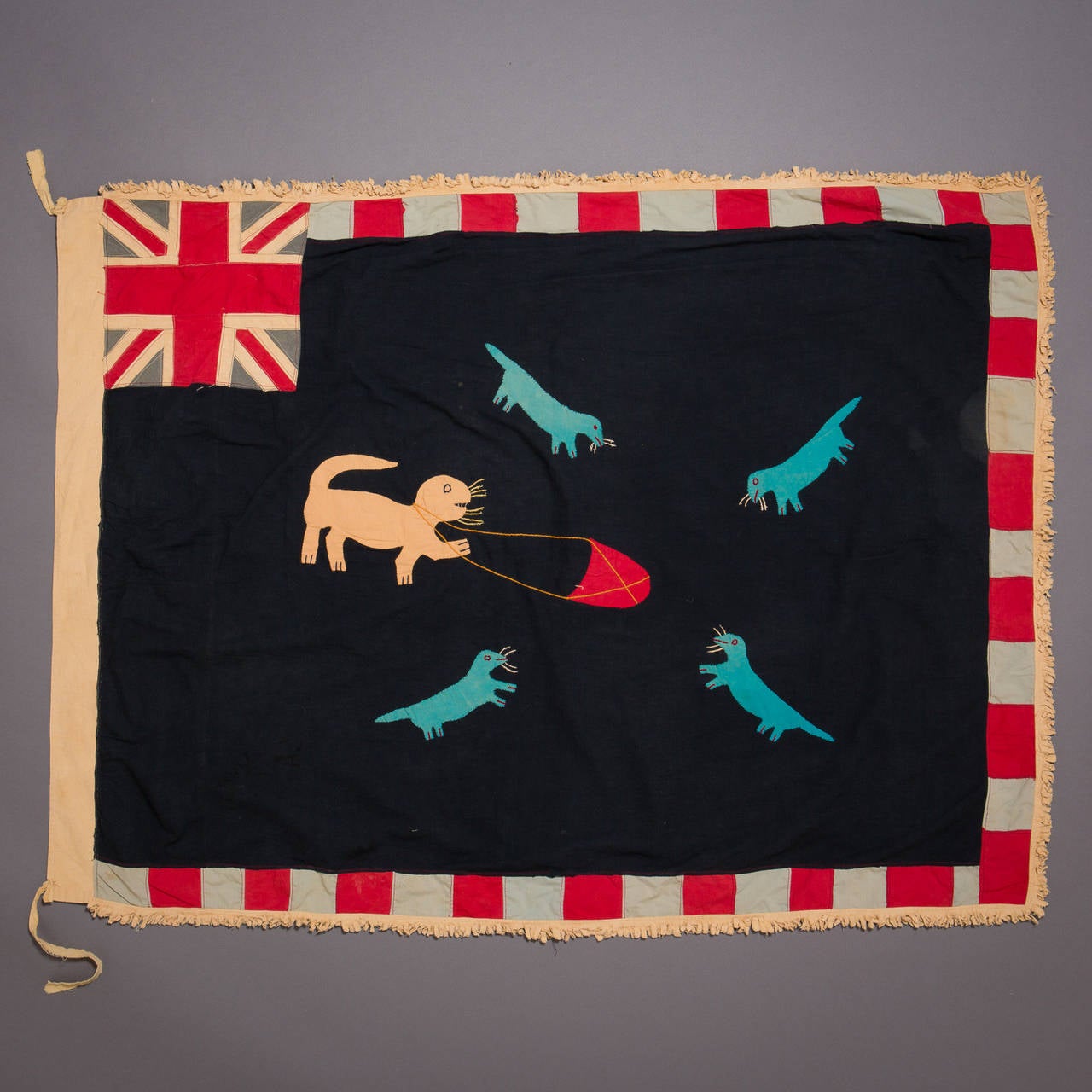 A large and graphically stunning Asafo flag.

Fante flags represent the merger of two cultural traditions, the Akan tradition of combining proverbs with visual imagery, and the European heraldic tradition, which used flags and banners displaying