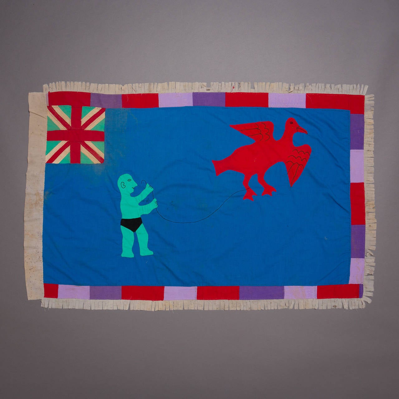 A large and graphically stunning Asafo flag.

Fante flags represent the merger of two cultural traditions, the Akan tradition of combining proverbs with visual imagery and the European heraldic tradition, which used flags and banners displaying