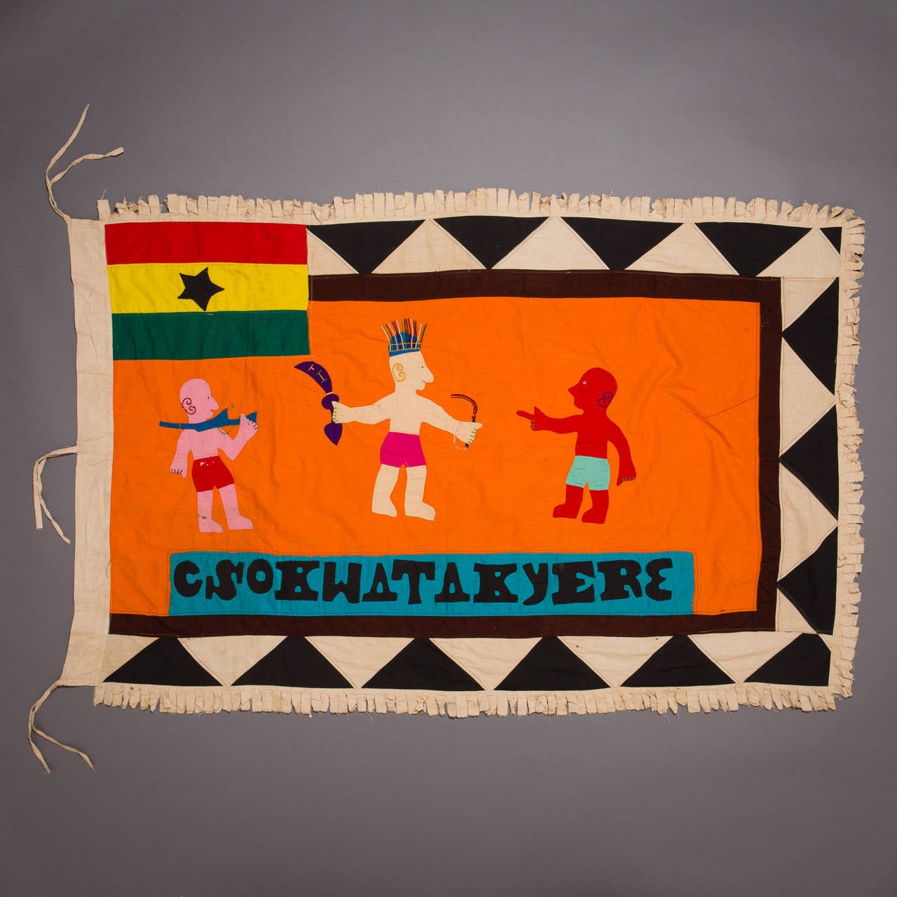 A large and graphically stunning Asafo flag.

Fante flags represent the merger of two cultural traditions, the Akan tradition of combining proverbs with visual imagery and the European heraldic tradition, which used flags and banners displaying