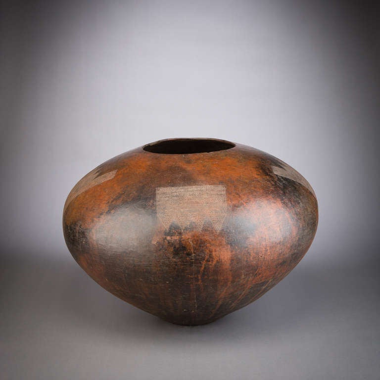 An exceptional Zulu beer vessel. This is the finest example we have ever owned. The pot has a satisfying form, is very large and has beautiful incised patterning.

Zulu pot making is the sole domain of women. Pots are made by using multiple thin