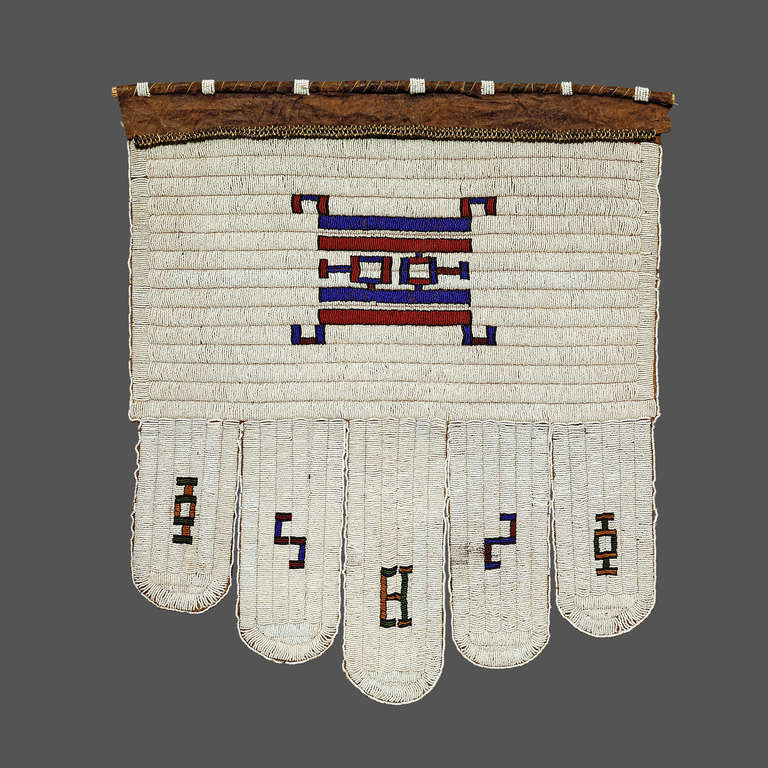 Ndebele beaded aprons (Jocolo) were made by and worn by women on ceremonial occasions. The Jocolo, with its five 