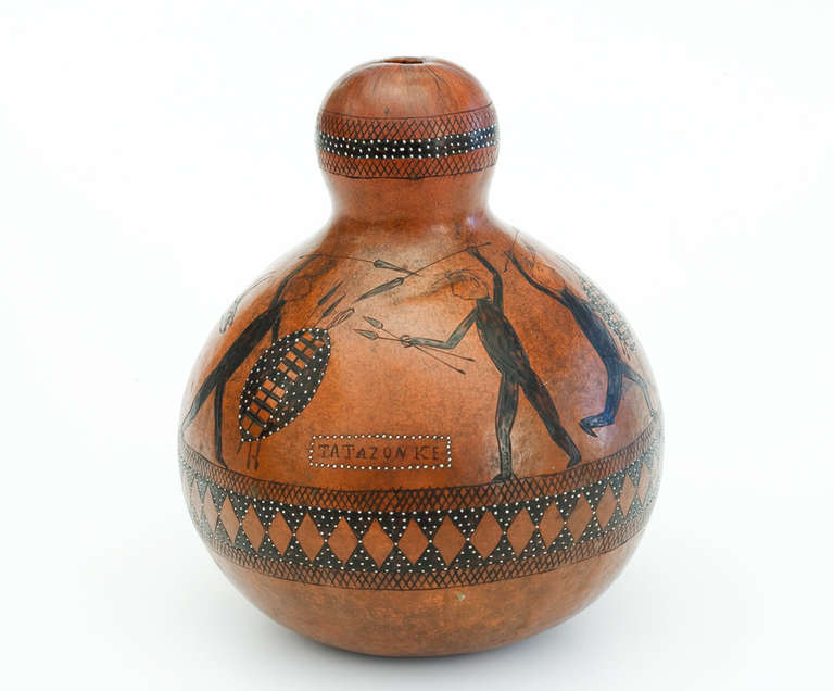 Rarely are we able to identify the hand of a particular traditional artist from southern Africa. However, the Swiss ethnographer Henri Junod, identifies the artist of this rare medicine gourd. It was made by a member of the Tembe clan in Mozambique.