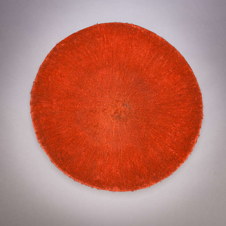 Hats in Africa are used much as they are in the United States and Europe: as decoration, but also to establish an image and make a stylistic and social statement.

This Zulu hat is made of human hair colored with red powder. It is worn