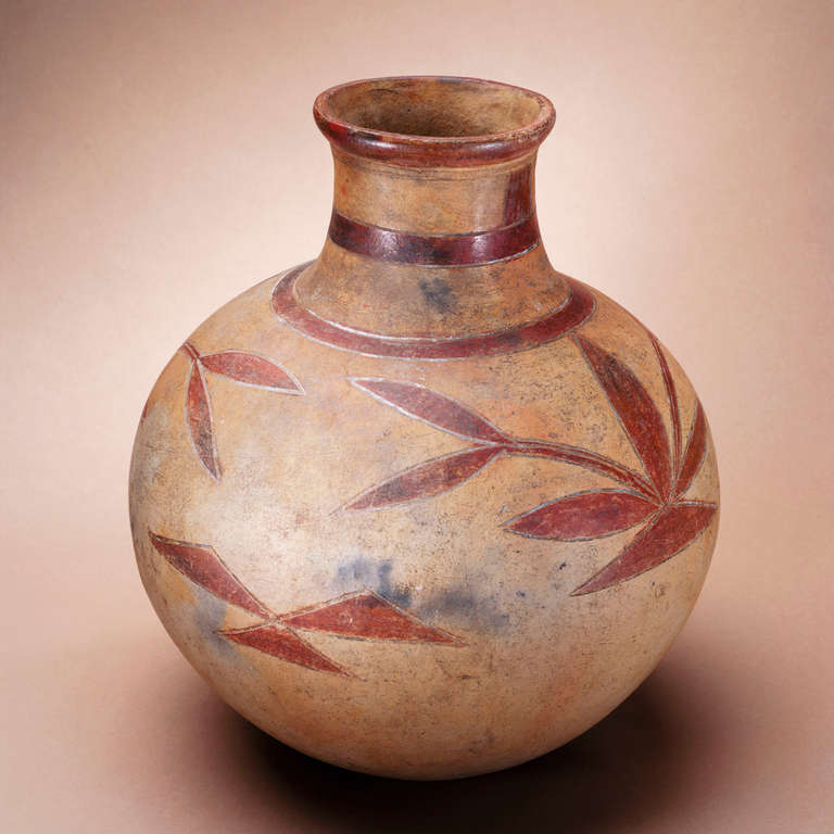 This beautiful African ceramic pot is decorated with etched and slip-decorated leaves and triangles.

The pot is museum-quality and is illustrated in the landmark book 