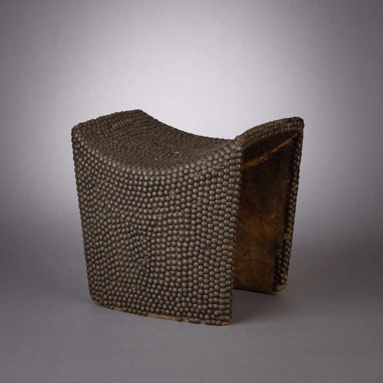 African Wooden Stool Covered in Brass Tacks
