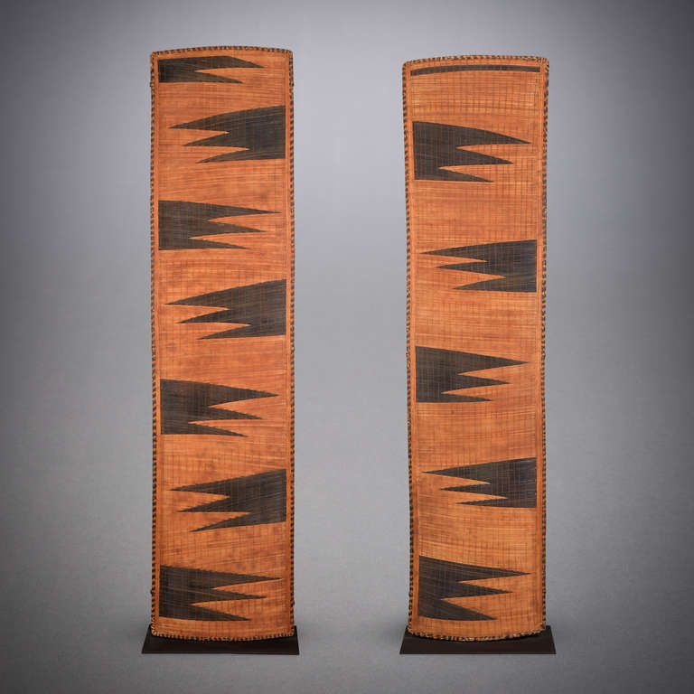 The art of weaving stands paramount in the creative traditions of the Rwandan tribes. With their distinctive, angular patterning, Tutsi weavings are instantly recognizable.

The specific pattern on this pair of screens is probably ibitoki,