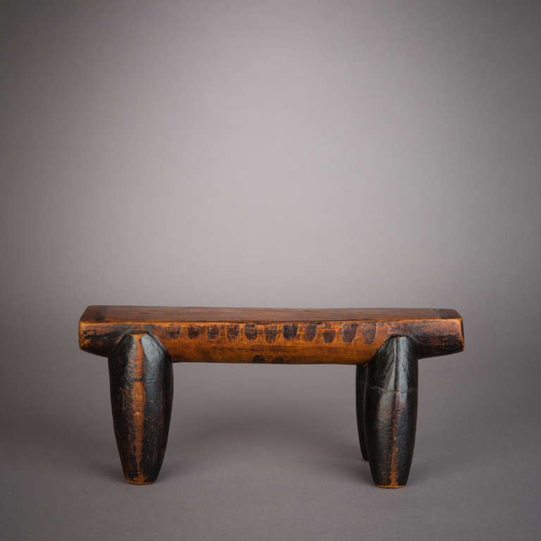 An old and elegant late 19th century Zulu headrest. Headrests were used by men and women to protect the elaborate hair styles when sleeping. They were also seen as vehicles to communicate with the ancestors while dreaming.

This is an early