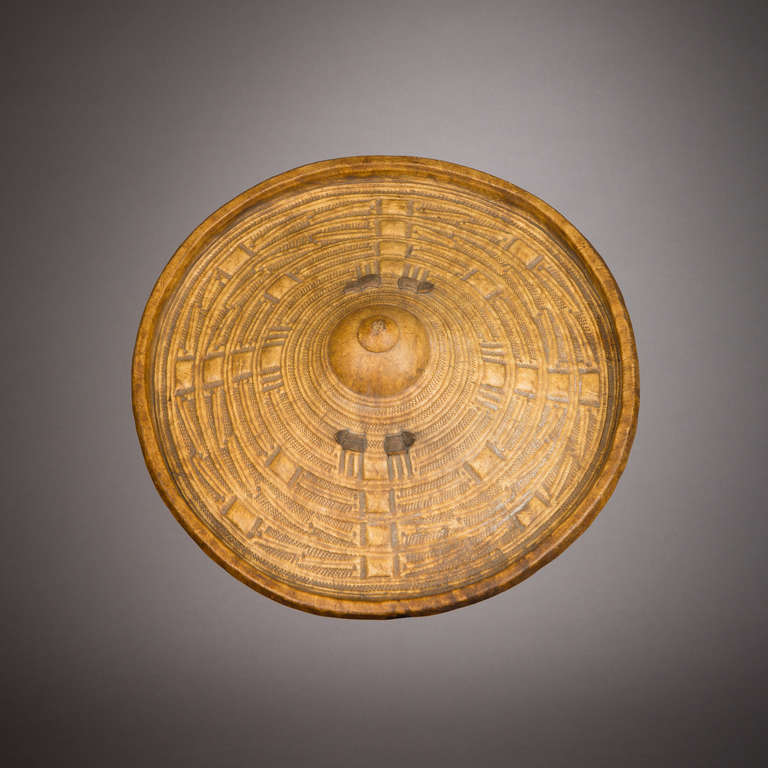 A magnificent shield made from oryx hide. The hide is bleached and incised with geometric patterns.

Somali warriors carried an iron spear, a short sword called a belawa, and a shield called a gãschãn. These shields were bleached white. Typical