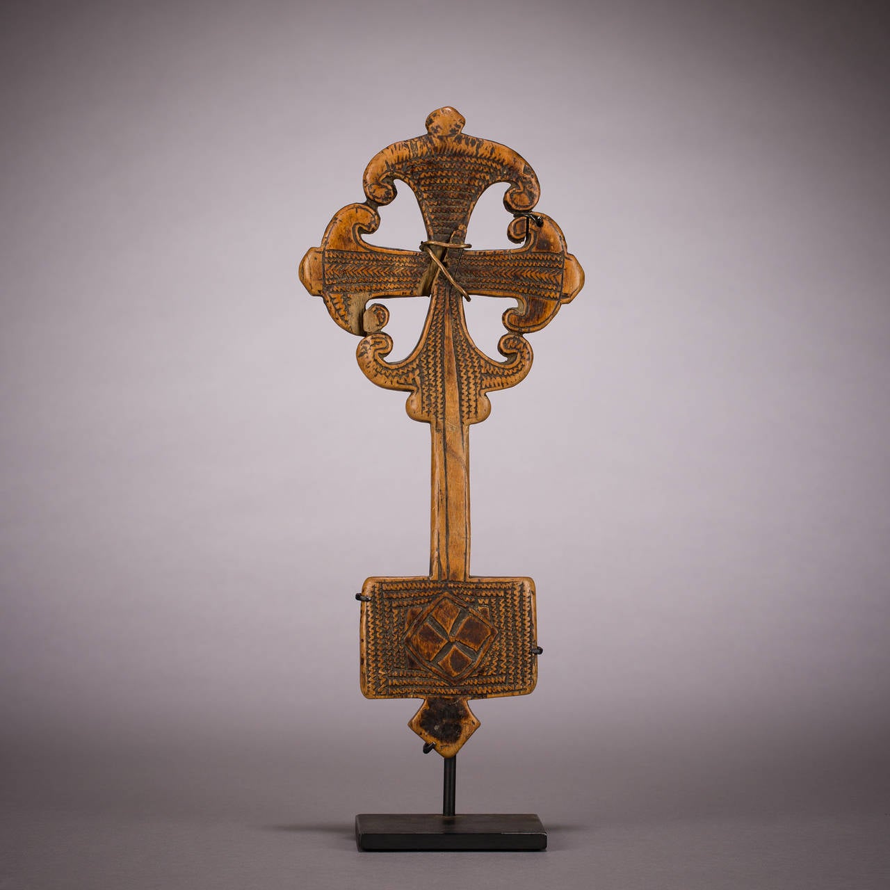 A beautiful ‘Horn of Lamb of God’ wooden hand cross from Shoa, Ethiopia, circa 1780-1830.

Ethiopian hand crosses are coveted by collectors of medieval art, religious art and tribal art for their beauty and variety of forms.

Ethiopia was