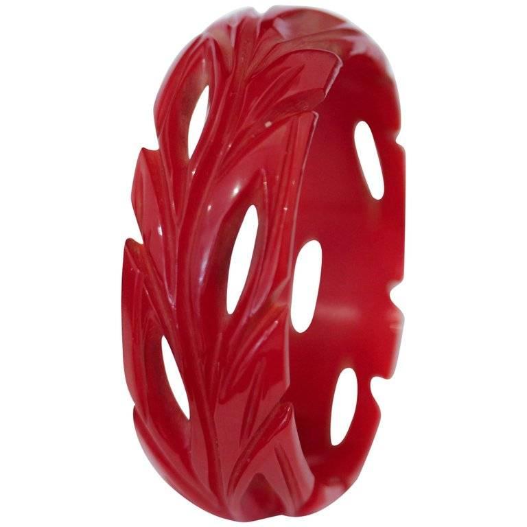 Art Deco Cherry Red Bakelite Bangle, Deep Leaf Carvings and Cut-Outs from Bangle For Sale