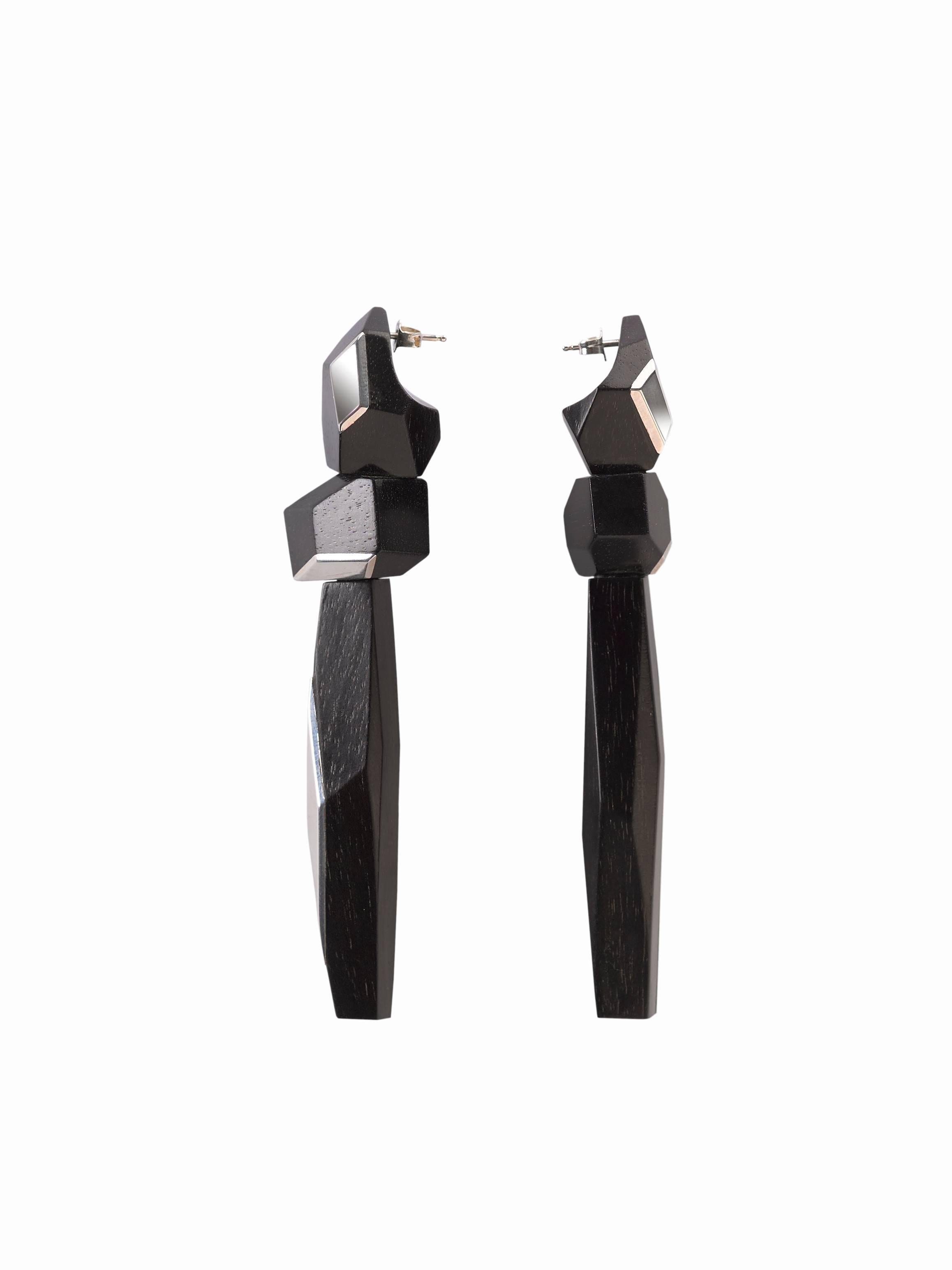 These pair of long dangling MATAR asymmetrical hand-carved ebony earrings celebrate the intricate craftsmanship of the past.  The jet black textured ebony is a perfect compliment to the high shine delicate sterling Rose gold inlays.
These weightless