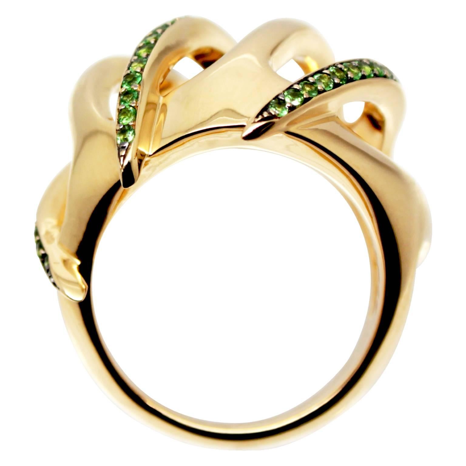 The Venus Flyrtap ring in made in 18ct Yellow Gold with interlocking spines that create an open dome effect. Half of which is  micro pave set with 82 Tsavorite Garnets in size from 0.9mm to 1.5mm with an approximate ct weight of 0.9ct. William has