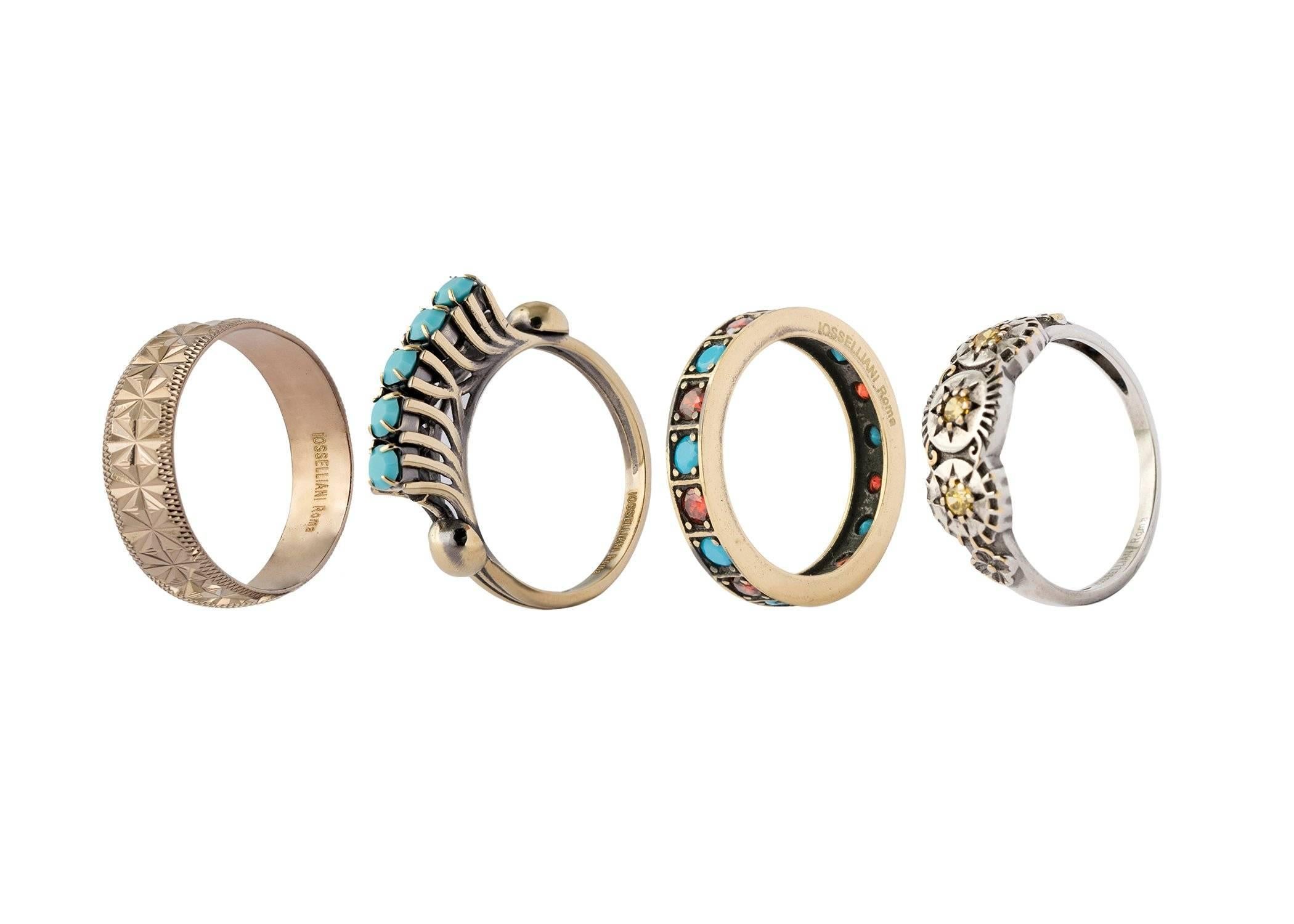 The Eleguà collection set of rings features four different rings projecting the stacking effect. A diamond cut band is mixed with colorful rings to inject a dose of color into accessories. Zircons are set by hand creating a shimmering effect. Wear