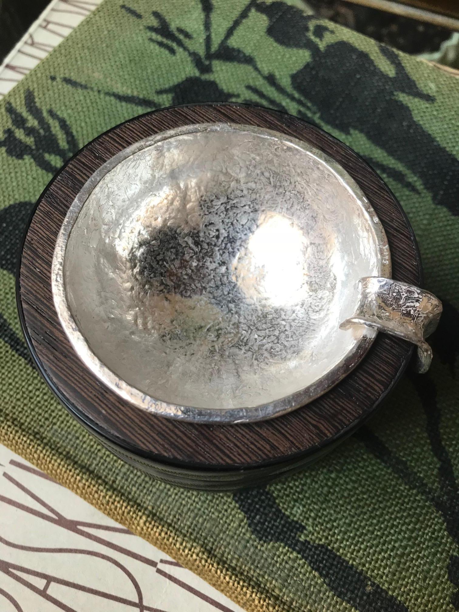 Ashtray of solid silver handmade in Italy by master craftsmen in Rome.
The removable hand hammered ashtray is set within African Wenge wood and cow horn.
Natural materials are crafted by highly skilled artisans in Africa & England. 
Silver total of