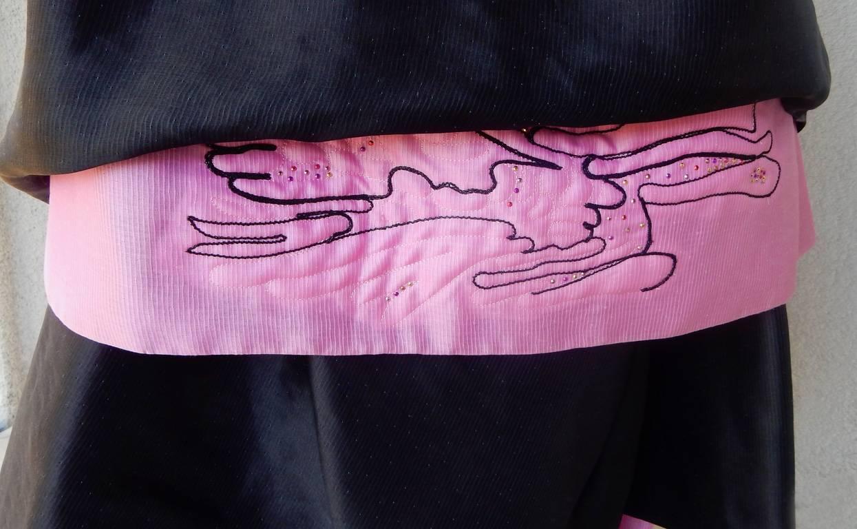 Circa 2000 Christian Lacroix black and petal pink strapless asymmetrical gown. Features detachable double tier skirts which can be worn as a ballgown or a short party pouf. Two dresses for the price of one! 

Fashioned of black silk gazar and