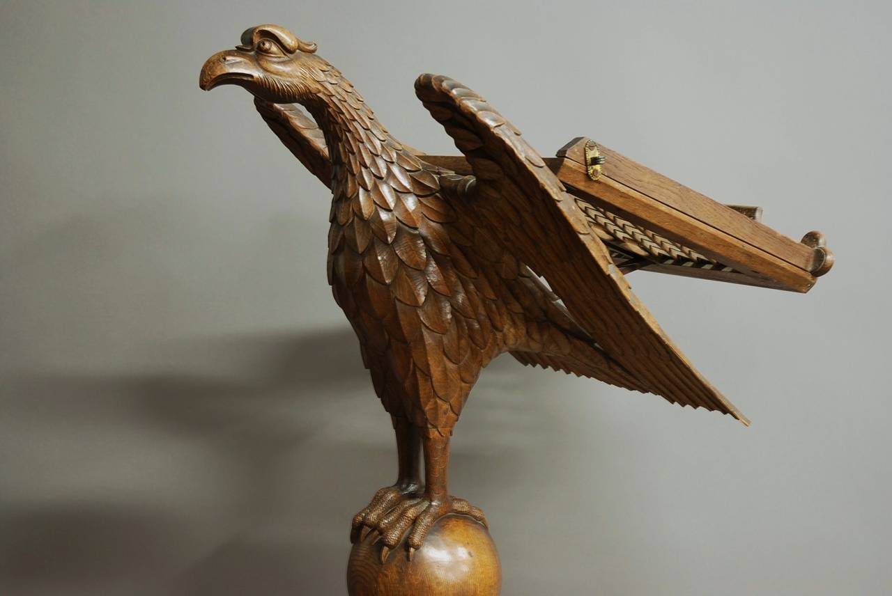 A late 19th century finely carved oak eagle lectern with adjustable reading stand.

The eagle is very finely and naturalistically carved and is supported on a ball column with a decorative carved square base.

This lectern would be ideal for
