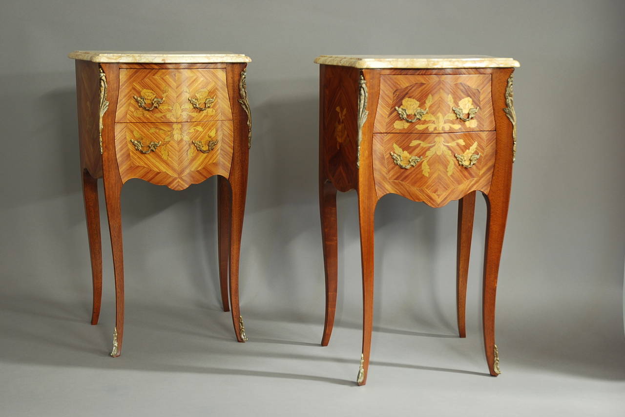 A fine quality pair of early 20th century Kingwood bedside commodes with marble tops.

These commodes consist of moulded edge & serpentine shaped pale yellow grain marble tops.

The main commode is of bombe shape form with serpentine shaped
