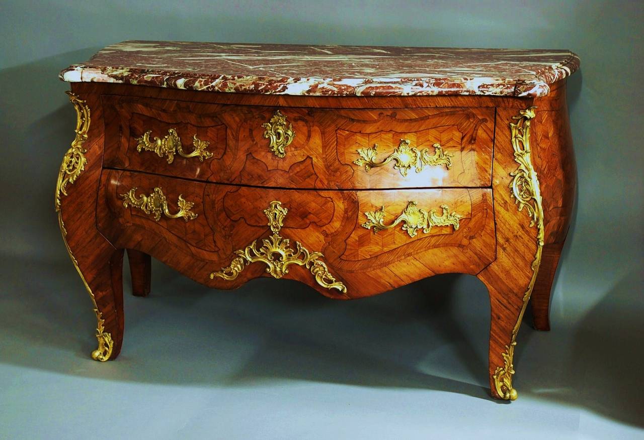 An extremely rare French early 18th century kingwood two-drawer bombe shaped Louis XV (1740) commode of bold proportions, stamped, possibly by Joseph F Oeben.

This commode consists of an original finely figured, shaped and moulded Rosso levanto