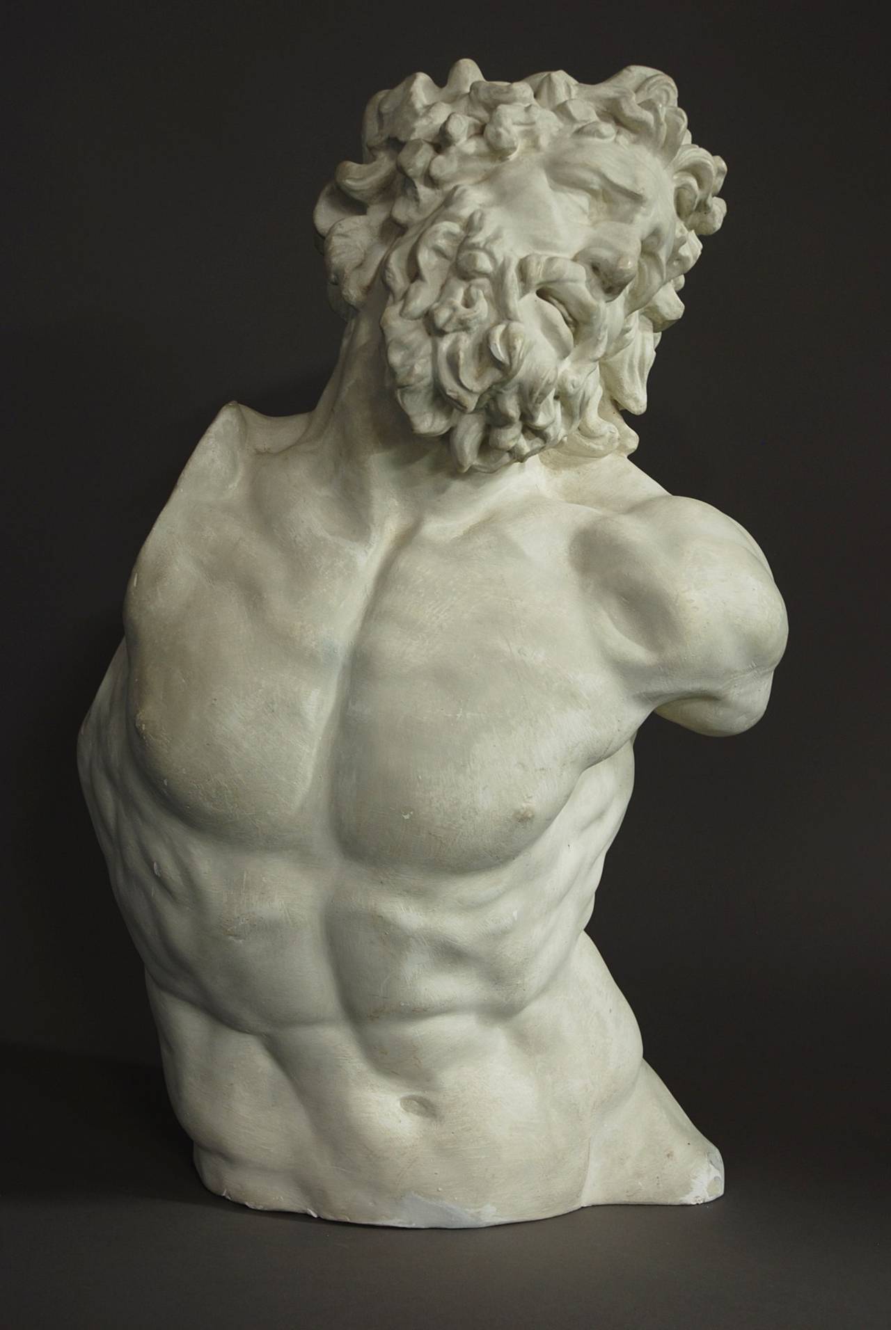 A plaster torso figure of the Trojan priest, Laocoon.

This figure is taken from the famous Italian statue 'Laocoon & His Sons' dating from 100BC and excavated in Rome in 1506 and can be seen in The Vatican.

In the sculpture he is depicted