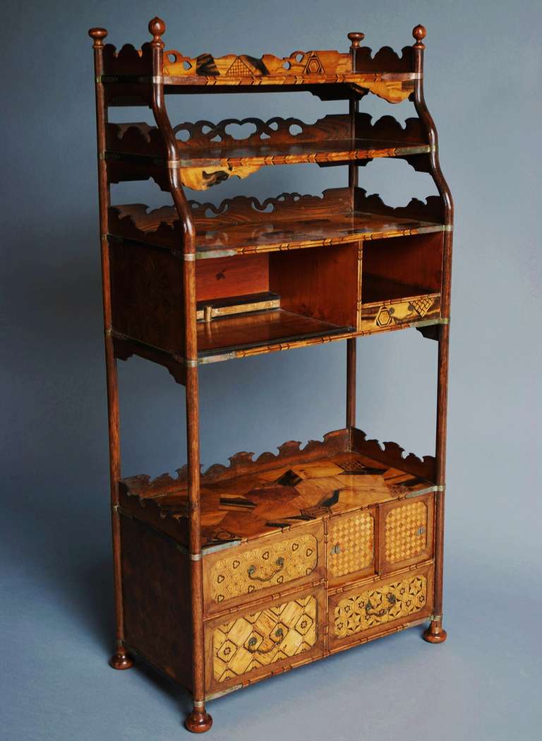 A mid/late 19th century, Japanese specimen wood parquetry inlaid cabinet of excellent quality. 

This piece has various storage compartments and shelves, inlaid with many exotic timbers in geometric designs (parquetry).

The side panels also