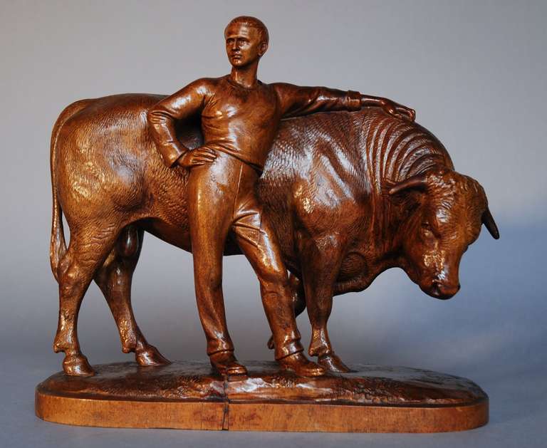 A finely carved late 19th century Black Forest linden wood carving of a prize bull with his proud master. 

Due to wood shrinkage there is a small amount of restoration to base but generally this piece is in very good condition.